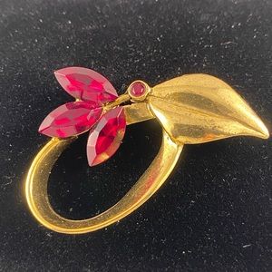 Vintage gold tone brooch with red marquis rhinestones